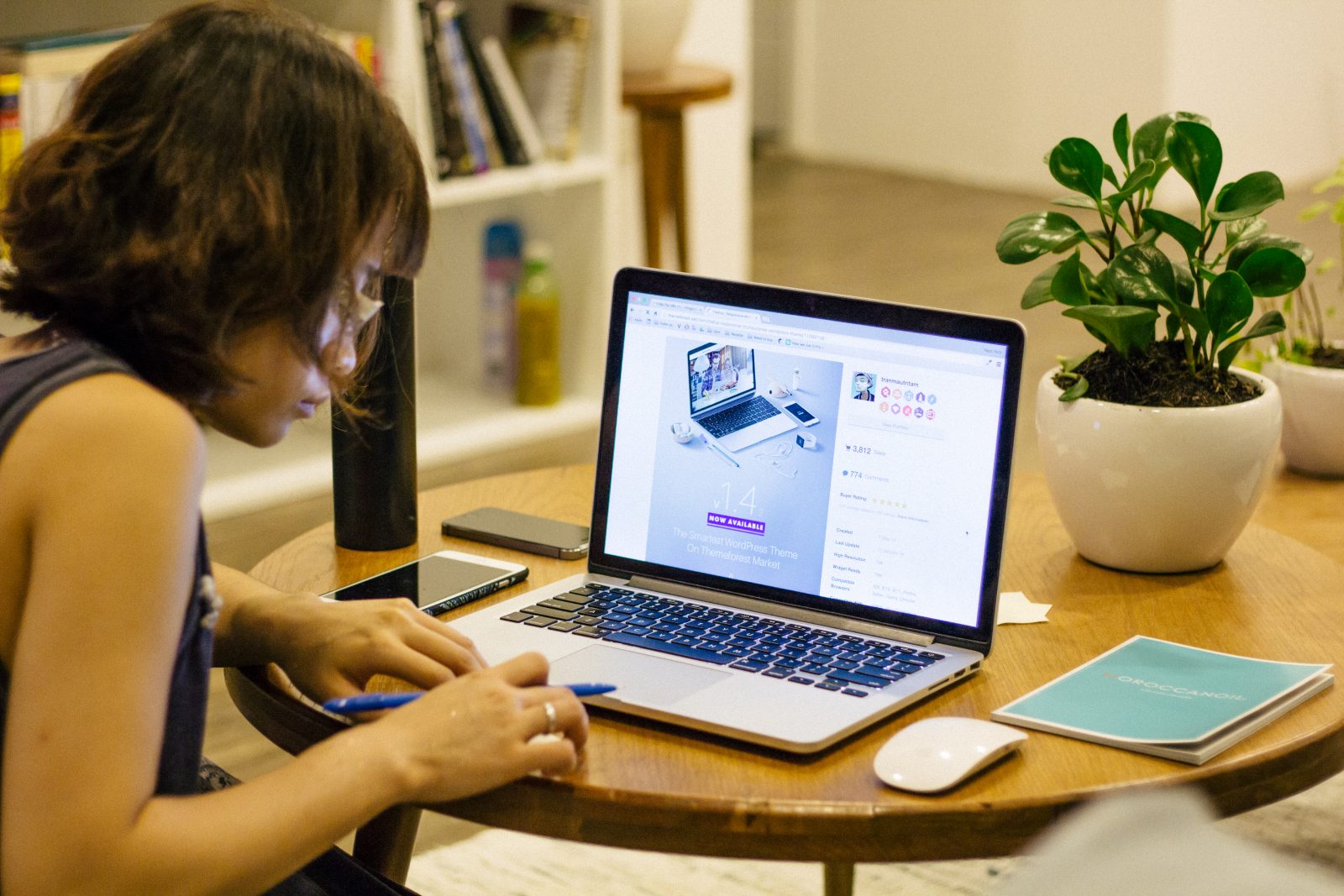 A young woman works at a laptop