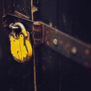 selective focus photography of yellow padlock