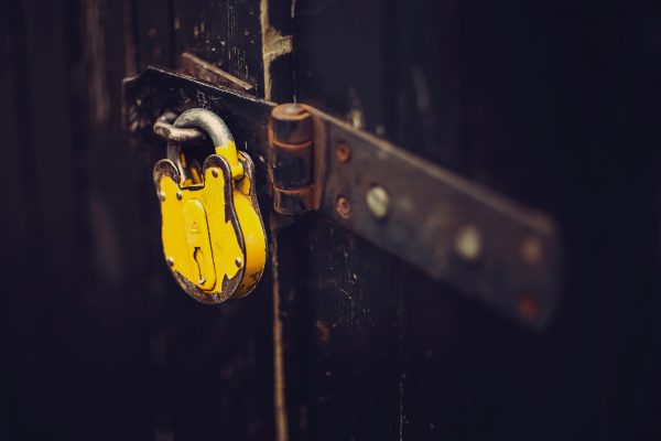 selective focus photography of yellow padlock